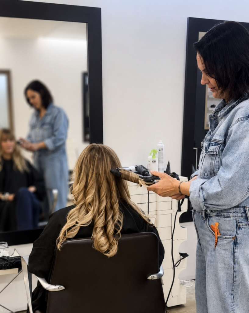 Andrea Grabher colouring hair at Color And Andy, an example of how to choose a hair colorist who works one to one